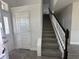 Inviting entryway featuring a staircase with dark wood accents at 7002 162Nd E Pl, Parrish, FL 34219