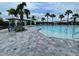 Community swimming pool with lounge chairs for relaxation and enjoyment at 7002 162Nd E Pl, Parrish, FL 34219