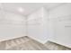 Walk-in closet with installed shelving and neutral carpet at 7002 162Nd E Pl, Parrish, FL 34219