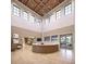 Elegant lobby with high ceilings, a curved reception desk, and comfortable seating at 12724 Tahitian Pearl Cir, Parrish, FL 34219