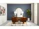 Bright home office features stylish furnishings and a large window at 12724 Tahitian Pearl Cir, Parrish, FL 34219