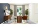 Modern home office with wood accents and ample natural light at 12724 Tahitian Pearl Cir, Parrish, FL 34219