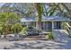 Charming house exterior with a lovely fountain and landscaping at 12945 Morris Bridge Rd, Thonotosassa, FL 33592