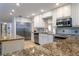 Modern kitchen with stainless steel appliances and granite counters at 12945 Morris Bridge Rd, Thonotosassa, FL 33592