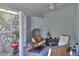 Screened porch with hanging chair and additional seating at 12945 Morris Bridge Rd, Thonotosassa, FL 33592