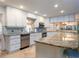 Bright kitchen with white cabinets and granite island at 12945 Morris Bridge Rd, Thonotosassa, FL 33592
