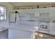 Bright kitchen featuring white cabinets and an island at 12945 Morris Bridge Rd, Thonotosassa, FL 33592