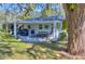 Relaxing patio with seating area, grill, and lush landscaping at 12945 Morris Bridge Rd, Thonotosassa, FL 33592