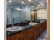 Bathroom boasts double vanity with granite countertop at 12945 Morris Bridge Rd, Thonotosassa, FL 33592