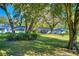 Single story home with mature trees and a large lawn in the backyard at 12945 Morris Bridge Rd, Thonotosassa, FL 33592