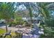 Home with a pond, bridge, and lush landscaping. Beautiful curb appeal at 12945 Morris Bridge Rd, Thonotosassa, FL 33592