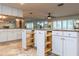 Spacious kitchen featuring granite countertops, stainless steel appliances, and ample cabinet storage at 12945 Morris Bridge Rd, Thonotosassa, FL 33592
