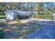 House exterior showcases a charming curb appeal at 12945 Morris Bridge Rd, Thonotosassa, FL 33592