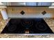 Modern kitchen cooktop with five induction burners at 12945 Morris Bridge Rd, Thonotosassa, FL 33592