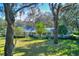 House exterior with light blue siding and mature landscaping at 12945 Morris Bridge Rd, Thonotosassa, FL 33592