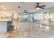 Large living area with tile floors and mirrored walls at 12945 Morris Bridge Rd, Thonotosassa, FL 33592