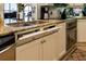 Convenient kitchen featuring a built-in recycling and trash system at 12945 Morris Bridge Rd, Thonotosassa, FL 33592