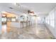 Open living area with tile flooring and kitchen bar at 12945 Morris Bridge Rd, Thonotosassa, FL 33592