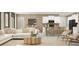 Open concept kitchen and living area, with an island and barstools at 6538 Back Forty Loop, Zephyrhills, FL 33541