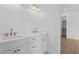 Modern bathroom features a double vanity with stone countertop and brushed gold hardware at 4005 W San Rafael St, Tampa, FL 33629
