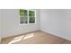 Sun-filled room with wood floors and large window at 4005 W San Rafael St, Tampa, FL 33629