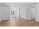 Spacious bedroom with light wood floors, white trim, and a large window at 4005 W San Rafael St, Tampa, FL 33629