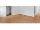 Spacious bedroom features hardwood floors, white walls, and a walk-in closet at 4005 W San Rafael St, Tampa, FL 33629