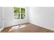 Bedroom featuring natural light, hardwood floors, and white walls and trim at 4005 W San Rafael St, Tampa, FL 33629