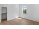 Bright bedroom with hardwood floors, walk-in closet, and natural light at 4005 W San Rafael St, Tampa, FL 33629