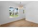 Bright dining room with hardwood flooring, view of a tree outside a large window at 4005 W San Rafael St, Tampa, FL 33629