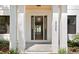 Inviting front entrance with grand columns and a clear view into the home's interior at 4005 W San Rafael St, Tampa, FL 33629