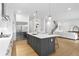 Kitchen featuring stainless steel appliances, an island with barstool seating, and hardwood floors at 4005 W San Rafael St, Tampa, FL 33629