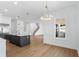 Open layout with a kitchen island, stairs, and a bright airy design at 4005 W San Rafael St, Tampa, FL 33629