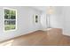 Sun-filled living room with hardwood floors, white walls, and decorative lighting at 4005 W San Rafael St, Tampa, FL 33629