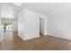 Open living room with hardwood floors, white walls, and lots of natural light at 4005 W San Rafael St, Tampa, FL 33629