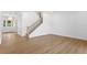 Open living space with hardwood floors and a staircase with black iron railings at 4005 W San Rafael St, Tampa, FL 33629
