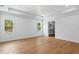Spacious main bedroom with hardwood floors, large windows, and a walk-in closet at 4005 W San Rafael St, Tampa, FL 33629