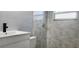 Clean bathroom with new vanity and shower at 10008 N Jasmine Ave, Tampa, FL 33612