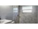 Updated bathroom with a shower and modern vanity at 10008 N Jasmine Ave, Tampa, FL 33612