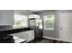Modern kitchen with stainless steel appliances and white cabinets at 10008 N Jasmine Ave, Tampa, FL 33612