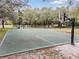 Full-size outdoor basketball court with a hoop at 34841 Double Eagle Ct, Zephyrhills, FL 33541