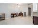Cozy dining area with tiled floor and a chandelier at 34841 Double Eagle Ct, Zephyrhills, FL 33541