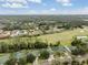 Aerial view showcasing homes and lush green landscape at 34841 Double Eagle Ct, Zephyrhills, FL 33541