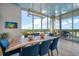 Elegant dining area with a live edge wood table and city views at 5120 Marina Way # 16005, Tampa, FL 33611