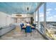 Open concept living and dining area with modern decor and water views at 5120 Marina Way # 16005, Tampa, FL 33611
