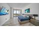 Modern bedroom with a king-size bed and large screen TV at 5120 Marina Way # 16005, Tampa, FL 33611