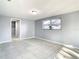Bright bedroom with a window and access to a closet at 3604 Rockaway Dr, Holiday, FL 34691