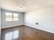 Spacious bedroom with hardwood floors and a window at 3604 Rockaway Dr, Holiday, FL 34691