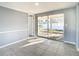 Living room with sliding glass doors leading to a patio at 3604 Rockaway Dr, Holiday, FL 34691