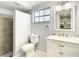 Clean bathroom with white vanity, marble countertop, and a walk-in shower at 3604 Rockaway Dr, Holiday, FL 34691